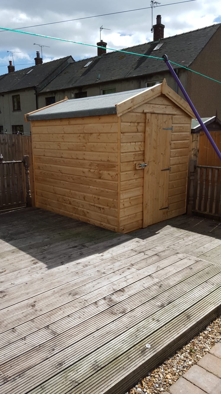 Loglap summer room with full-length glazed doors and decking installed in Musselburgh East Lothian